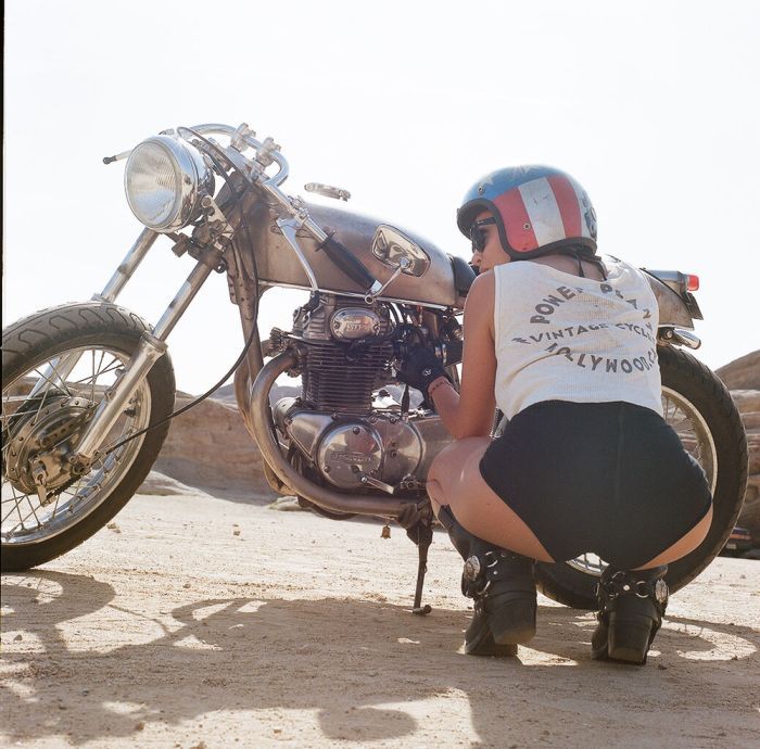 A playful frame from Girls on a motorcycle — online in Beijing